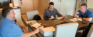 Photo of a one-on-one meeting held during the LM Growth Summit