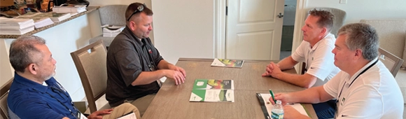 Photo of a one-on-one meeting held during a recent LM Growth Summit