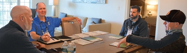 Photo of a one-on-one meeting held during a recent LM Growth Summit