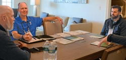 Photo of a one-on-one meeting held during the Growth Summit